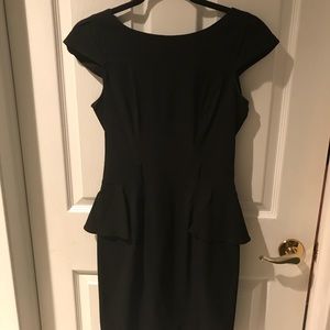 Black peplum dress. Knee length.
